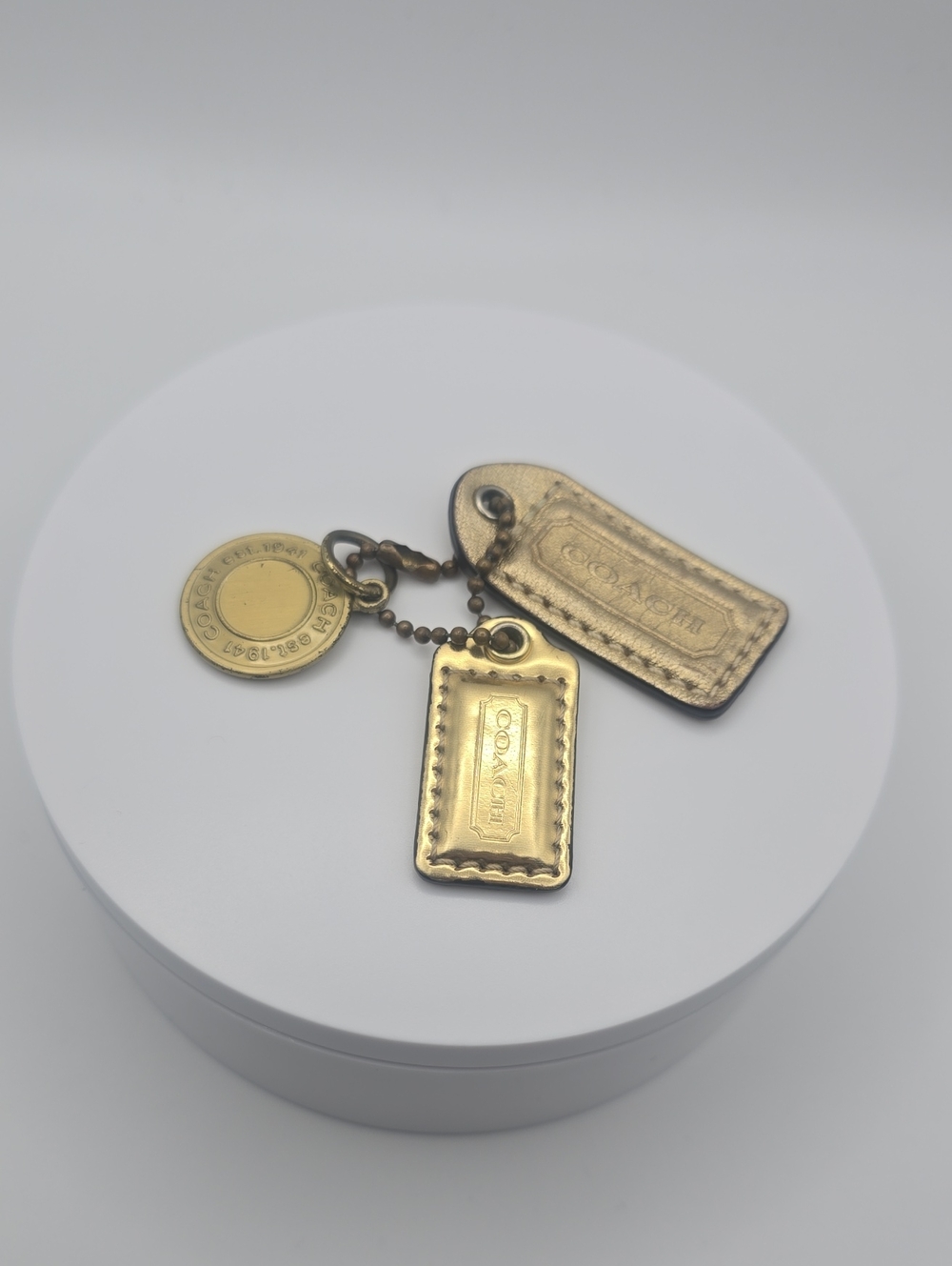 Coach Gold-Tone Logo Coin Charm W/ Gold Hang Tags Keychain/Bag Charm (EUC)✨️